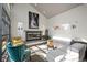 Bright living room featuring a modern fireplace and an industrial style glass door at 2957 Osceola St, Denver, CO 80212