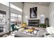 Living room featuring a modern fireplace, hardwood floors, and an industrial style glass door at 2957 Osceola St, Denver, CO 80212