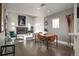 Bright living room with large fireplace, hardwood floors, and neutral colored decor at 2957 Osceola St, Denver, CO 80212