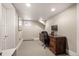 Functional home office with a large desk, comfortable chair, and a window for natural light at 2957 Osceola St, Denver, CO 80212