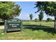 Scenic view of Sloan's Lake Park with walking path and lush green space under a blue sky at 2957 Osceola St, Denver, CO 80212
