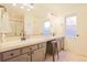 Bathroom featuring double sinks, tile floors, and ample counter space at 5316 Stuart St, Denver, CO 80212