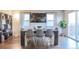 Modern dining area featuring a large table, stylish chairs, and plenty of natural light at 5316 Stuart St, Denver, CO 80212