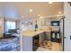 Cozy kitchen featuring modern appliances and easy access to the adjacent living room at 5316 Stuart St, Denver, CO 80212