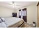 Relaxing bedroom with a ceiling fan, soft bedding, a large TV and a window that offers natural light at 11009 Gaylord St, Northglenn, CO 80233