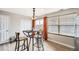 Inviting dining area with a table, chairs, and a large window offering great natural light at 11009 Gaylord St, Northglenn, CO 80233