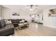 Bright living room with modern wood floors, neutral tones, and ceiling fan at 11009 Gaylord St, Northglenn, CO 80233