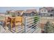 Spacious deck perfect for outdoor dining and entertainment with table, chairs, and pleasant views at 1218 Sugarloaf Ln, Erie, CO 80516