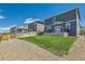 Spacious backyard with a manicured lawn and fenced perimeter at 2417 Mountain Sky Dr, Fort Lupton, CO 80621