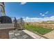 Backyard with a well maintained lawn and patio steps at 2417 Mountain Sky Dr, Fort Lupton, CO 80621