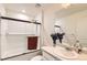 Modern bathroom featuring a shower over tub, glass screen, and large vanity with decor at 2417 Mountain Sky Dr, Fort Lupton, CO 80621