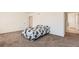 Bedroom featuring a bed with seahorse patterned bedding and multiple doorways at 2417 Mountain Sky Dr, Fort Lupton, CO 80621