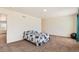 Bedroom featuring a bed with seahorse patterned bedding and an open doorway at 2417 Mountain Sky Dr, Fort Lupton, CO 80621