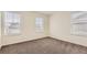 Neutral bedroom with three windows for ample natural light at 2417 Mountain Sky Dr, Fort Lupton, CO 80621
