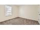 Bright bedroom with plush carpeting and a single window, offering a serene atmosphere at 2417 Mountain Sky Dr, Fort Lupton, CO 80621