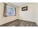 Bright bedroom with wood floors, large window and artwork at 2417 Mountain Sky Dr, Fort Lupton, CO 80621