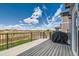 Relaxing deck with a grill and views of the surrounding landscape at 2417 Mountain Sky Dr, Fort Lupton, CO 80621