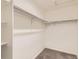 Spacious walk-in closet with built-in shelving and ample storage space at 2417 Mountain Sky Dr, Fort Lupton, CO 80621