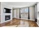 Open concept living room with hardwood floors and fireplace at 10298 Tall Oaks Cir, Parker, CO 80134