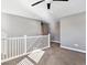 Loft area with white railing and carpet at 10298 Tall Oaks Cir, Parker, CO 80134