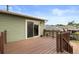 Exterior view of the wooden deck leading to the lush backyard at 11823 Steele St, Thornton, CO 80233