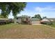 Expansive backyard showing a deck and ample green space, ideal for relaxation and entertainment at 11823 Steele St, Thornton, CO 80233