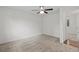Bright bedroom with neutral carpeting and a doorway to another room at 11823 Steele St, Thornton, CO 80233