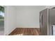 Kitchen features wood flooring, stainless steel appliances, and lots of natural light at 11823 Steele St, Thornton, CO 80233