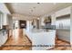 Modern kitchen features stainless steel appliances, white cabinets, and hardwood floors at 3367 Prospector Dr, Broomfield, CO 80023