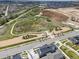 An aerial view of a neighborhood park and adjacent residences, showcasing community amenities at 6777 Larsh Dr, Denver, CO 80221