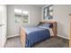 Bright bedroom with double bed and neutral decor at 6777 Larsh Dr, Denver, CO 80221