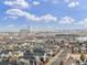 A high-angle view captures a cityscape and residential area in front of a mountain at 6777 Larsh Dr, Denver, CO 80221