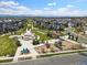 Aerial view of a well-maintained community park and playground near modern residences at 6777 Larsh Dr, Denver, CO 80221