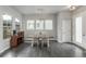 Dining room with four chairs and built-in cabinetry at 6777 Larsh Dr, Denver, CO 80221