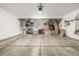 Garage with storage shelving and space for vehicles at 6777 Larsh Dr, Denver, CO 80221