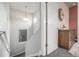 Hallway featuring carpeted stairs, natural light, and a wooden cabinet with drawers to the side at 6777 Larsh Dr, Denver, CO 80221