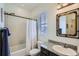 Bathroom featuring a shower-tub combo, toilet, and vanity with granite countertop at 15226 W 93Rd Ave, Arvada, CO 80007