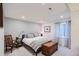 Cozy bedroom with soft lighting, comfortable bed, decorative chest and calming decor at 15226 W 93Rd Ave, Arvada, CO 80007