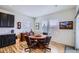 Cozy dining area with hardwood floors, bright windows, and an adjacent kitchen area at 15226 W 93Rd Ave, Arvada, CO 80007
