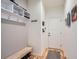 Functional entryway with coat hooks, storage bench, and door to garage at 15226 W 93Rd Ave, Arvada, CO 80007