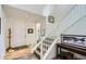 Bright foyer with hardwood floors, coat rack, and a staircase at 15226 W 93Rd Ave, Arvada, CO 80007