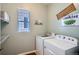 Functional laundry room area with modern washer and dryer units at 15226 W 93Rd Ave, Arvada, CO 80007