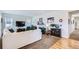 Bright living room with neutral carpet, lots of windows, and a fireplace at 15226 W 93Rd Ave, Arvada, CO 80007