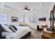 Bright main bedroom with a tray ceiling, desk area, and plush carpeting for comfort at 15226 W 93Rd Ave, Arvada, CO 80007