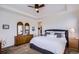 Main bedroom with neutral carpet, ceiling fan, and walk-in closet at 15226 W 93Rd Ave, Arvada, CO 80007