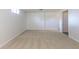 Large basement featuring neutral carpeting and white walls, perfect for flexible use at 7111 Clermont St, Commerce City, CO 80022