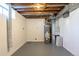 Basement utility area showcasing mechanical equipment and painted concrete floors at 7111 Clermont St, Commerce City, CO 80022