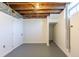 Unfinished basement area, with visible ceiling structure and utility connections, ready for customization at 7111 Clermont St, Commerce City, CO 80022