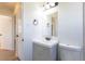 Bathroom with a modern sink and vanity, complemented by neutral walls and fixtures at 7111 Clermont St, Commerce City, CO 80022