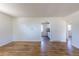 Spacious living room with hardwood floors and arched entryway to the kitchen at 7111 Clermont St, Commerce City, CO 80022